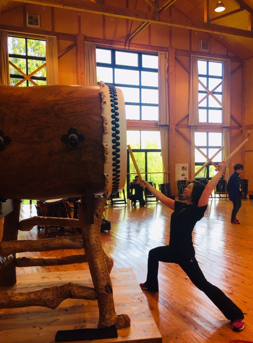 Playing the huge taiko drum